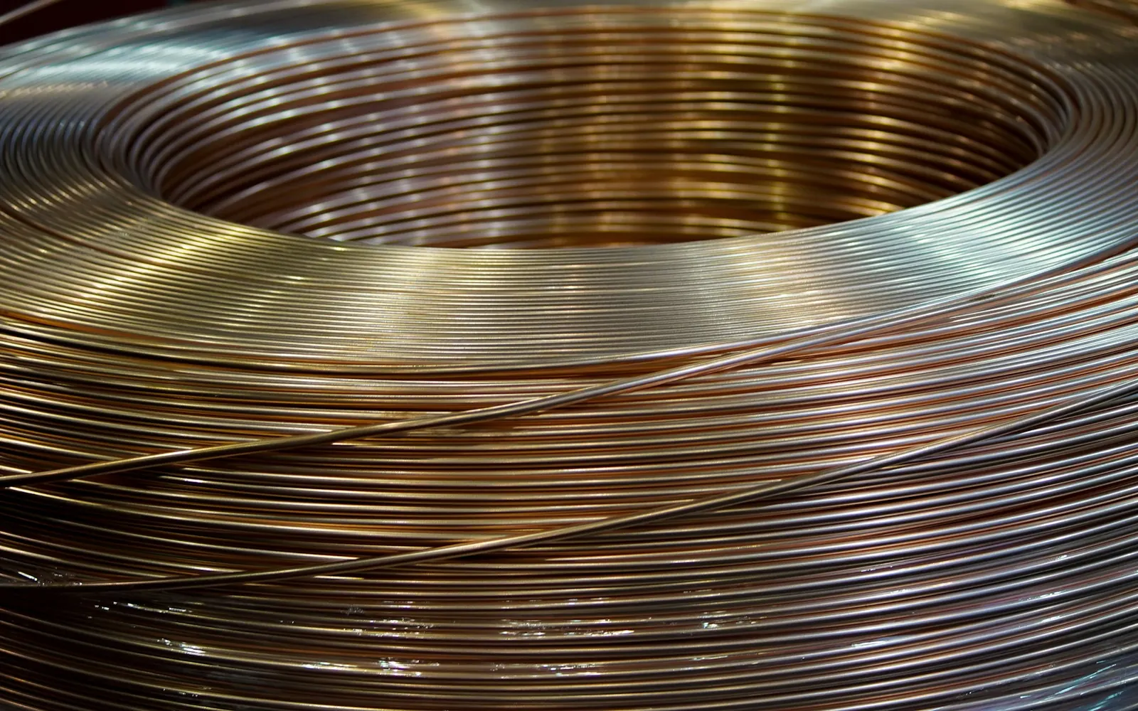 A coil of copper wire with natural metallic reflections